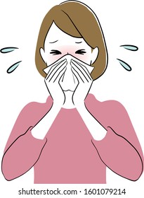 Woman with allergy symptoms blowing nose