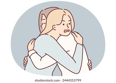 Woman with angry expression hugs girl friend hiding envy or jealousy in order to deceive. Concept hypocrisy and lack of trust between close relatives or old friends due to envy and insincerity