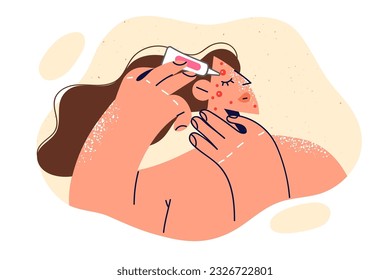 Woman applies cream to pimple on face, fights rash or redness associated with puberty. Girl uses cosmetics to fight acne and takes care of skin, wanting become attractive and like men