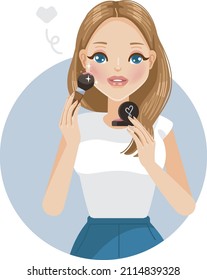 woman applying blush on at cheek makeup of cosmetic