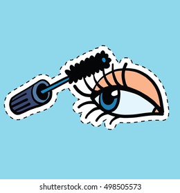 Woman applying mascara on her long eyelashes