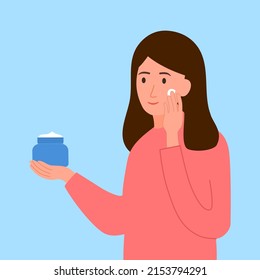 Woman applying moisturizing cream on her face in flat design. Skin care beauty product.