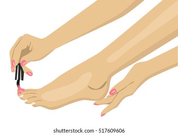 woman applying nail polish on her toes