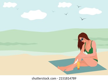 woman applying sun cream on the beach