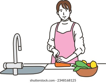 Woman in an apron cutting vegetables in the kitchen
