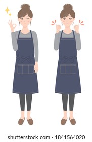 A woman in an apron doing an OK pose
A woman in an apron doing a guts pose