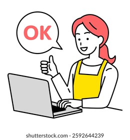 Woman in an apron making an OK sign while using a laptop