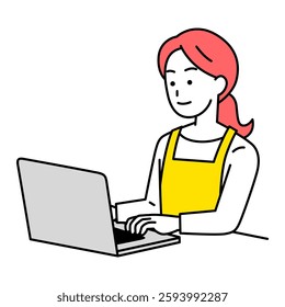 Woman in an apron operating a laptop