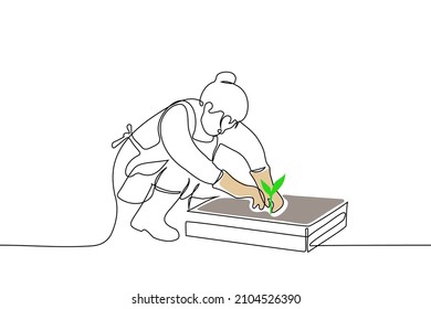 mujer en delantal se sienta frente a la caja con tierra, sobre botas de goma y guantes, jardinero sujetando plántulas jóvenes - un vector de dibujo de una línea. concepto de huerto vegetal, plántulas replantadas