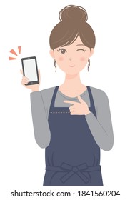 A woman in an apron with a smartphone
