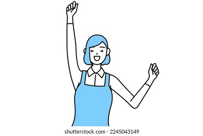 A woman in an apron smiling and jumping.