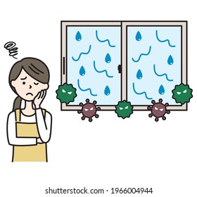 Woman in apron suffering from mold caused by condensation on window