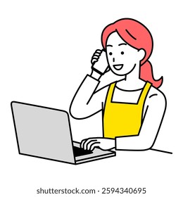 Woman in an apron talking on the phone while working on a laptop