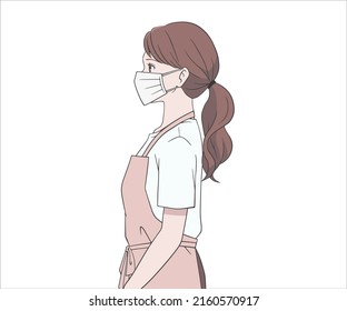 A woman in an apron wearing a mask and looking sideways