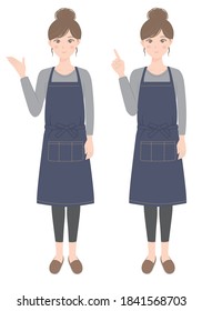 A woman in an apron who is guiding
A woman in an apron pointing her finger