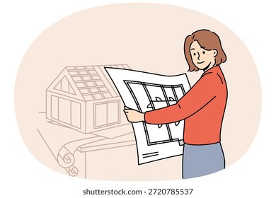 Mujer arquitecta crea Planes de ingeniería y modelos de casas futuras, trabajando en oficinas de construcción. Chica arquitecta de una empresa de arquitectura sostiene el Plan de la mansión habitación por habitación y mira la pantalla