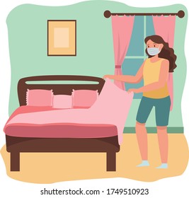 Woman is arranging her bed well while using medical mask
