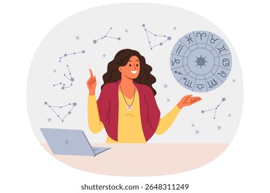 Mulher astróloga conta fortunas por horóscopo e prevê futuro por estrelas, de pé perto da mesa com laptop. Menina astróloga aponta para cima, oferecendo-se para ler gorsk, de pé perto da roda com signos do zodíaco
