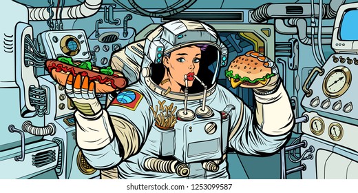 Woman astronaut eats in a spaceship. Cola, hot dog and Burger fast food. Pop art retro vector illustration kitsch vintage