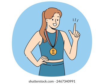 Woman athlete with sports medal for second place in running or gymnastics competition points up and smile. Champion girl recommends purchasing quality sportswear to achieve success in sports career