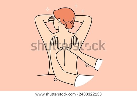 Woman attends massage treatments in SPA salon, lying with bare back and enjoying rejuvenation therapy. Hands of massage specialist kneading skin of relaxed girl, is tired after difficult work week