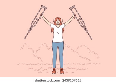 Woman with axillary crutches rejoices in recovery health legs and opportunity not to use auxiliary medical equipment. Girl gets rid of armpit crutches after undergoing rehabilitation in hospital