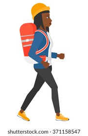 Woman with backpack hiking.