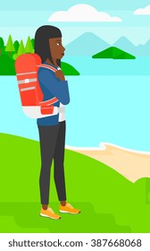 Woman with backpack hiking.