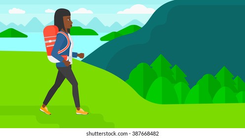 Woman with backpack hiking.