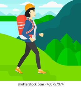Woman with backpack hiking.