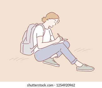 A woman with a backpack sat on the ground and is writing something on her notebook. hand drawn style vector design illustrations.