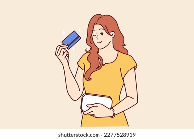 Woman with bank card winking recommend using reliable banking or credit product with large cashback. girl shows credit card intended for bargain purchases or cash withdrawals from ATM 