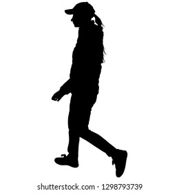 woman in baseball cap and sneakers