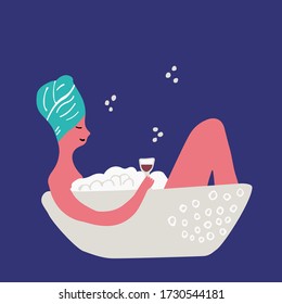 Woman in the bath with glass of wine