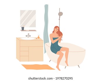 Woman in bath towel applies hair conditioner in bathroom after shower at home. Hair care