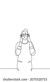 Woman With Beam On Her Head Puts On Glasses On Herself- One Line Drawing Vector. Concept Of Trying On New Glasses, Losing Sight And Starting To Wear Glasses, Computer Glasses For Work 