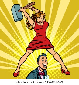 Woman beats a man with a hammer. Comic cartoon pop art retro vector illustration drawing