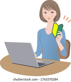 A woman with a beginner mark in front of a personal computer