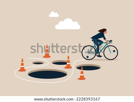 Woman with Bicycle  pass many pitfalls to achieve business success. Avoid pitfall, adversity and brave to around pass mistake or business failure, skill and creativity to solve problem concept.