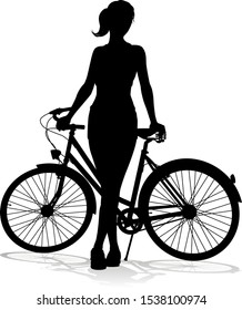 A woman bicycle riding bike cyclist in silhouette