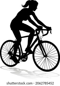 A woman bicycle riding bike cyclist in silhouette