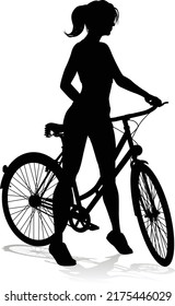 A woman bicycle riding bike cyclist in silhouette