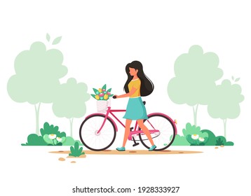 Woman with a bike with flowers in the basket. Springtime. Vector illustration.