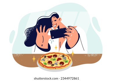 Woman blogger takes picture pizza on phone to post review and tell followers about new pizzeria. Happy girl SMM specialist makes snapshot pizza for launch advertising campaign for italian restaurant