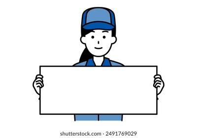 Woman in blue work clothes holding a horizontal placard