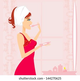 woman brushing her teeth in the bathroom