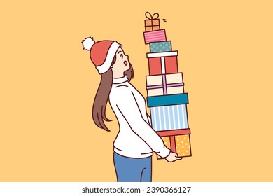 Woman with bunch of christmas gifts in hands is in shock and is afraid to drop boxes presented by santa claus for new year. Surprised girl holding gifts received for participating in christmas sale