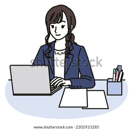 A woman in a business casual outfit using a computer Foto stock © 