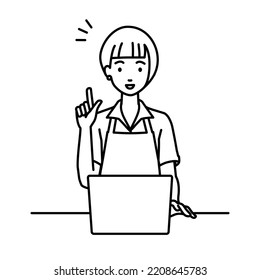 a woman in cafe apron using laptop computer getting ideas with pointing hand gesture at her desk