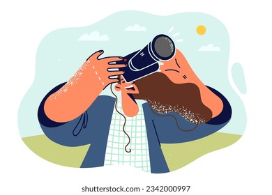 Woman with camera smiles and takes picture of sky to capture summer trip for social networks. Cheerful girl photographer in casual clothes directs camera to sky, for concept spotting hobby